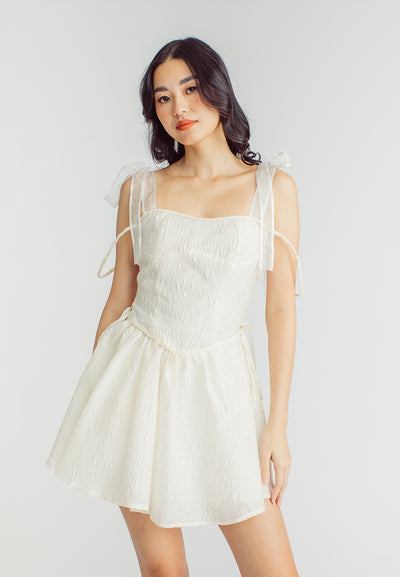 Elle Cream Textured Square Neck Sleeveless Self Tie Strap Pleated Mini Dress