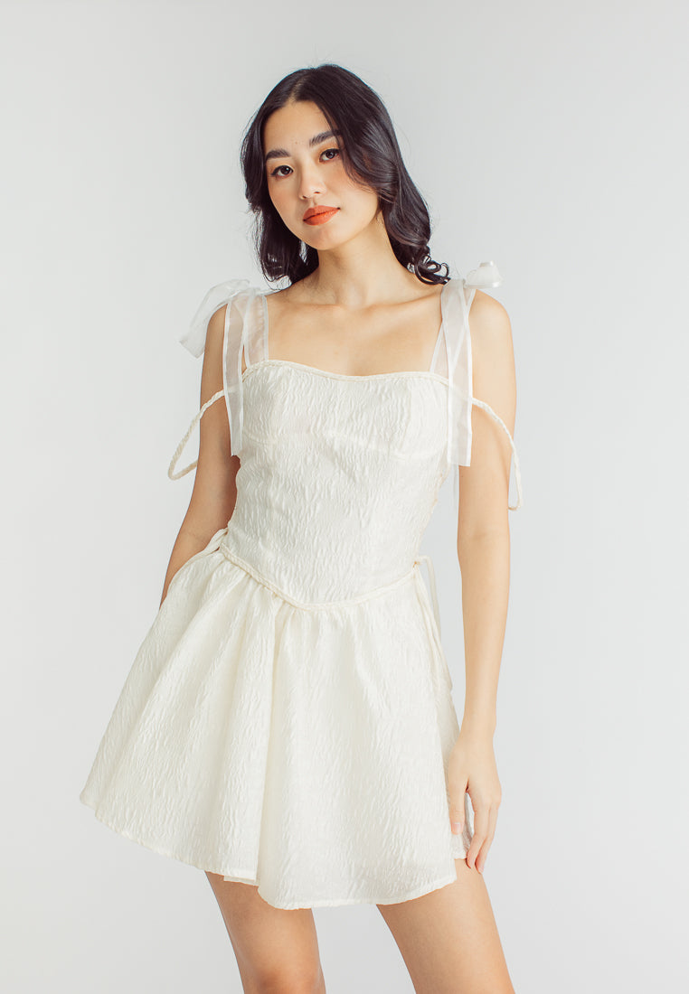 Elle Cream Textured Square Neck Sleeveless Self Tie Strap Pleated Mini Dress