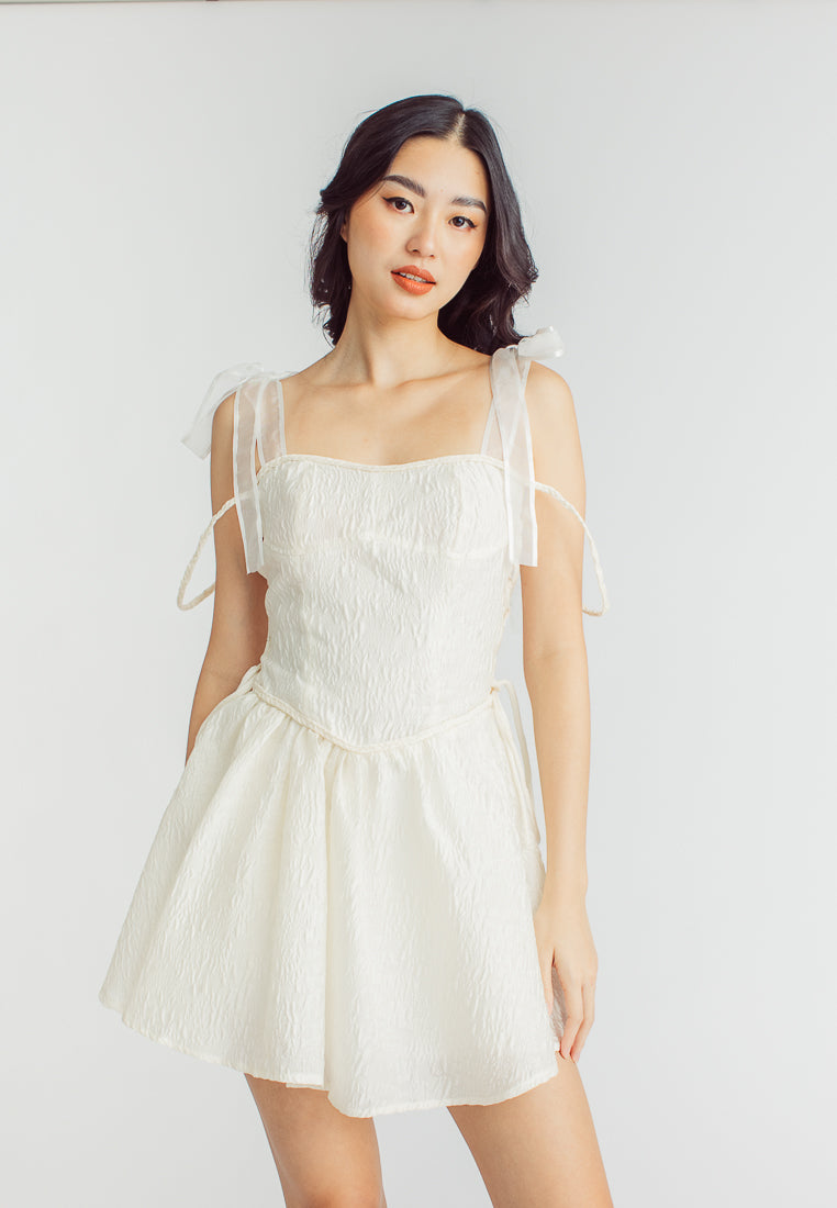 Elle Cream Textured Square Neck Sleeveless Self Tie Strap Pleated Mini Dress