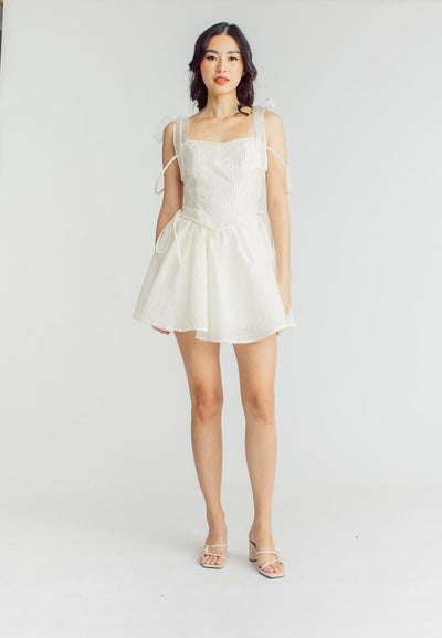 Elle Cream Textured Square Neck Sleeveless Self Tie Strap Pleated Mini Dress