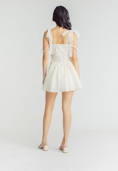 Elle Cream Textured Square Neck Sleeveless Self Tie Strap Pleated Mini Dress
