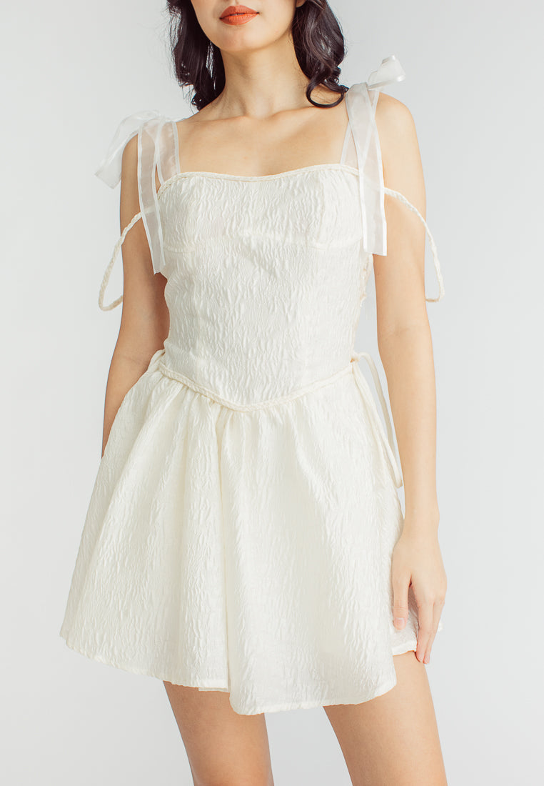 Elle Cream Textured Square Neck Sleeveless Self Tie Strap Pleated Mini Dress