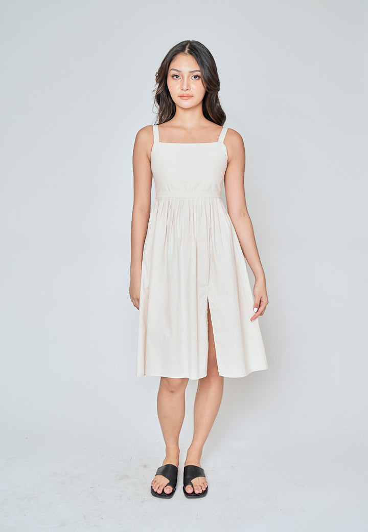 Yoshie Off White Sleeveless Zipper Back Pleated Side Slit Midi Dress