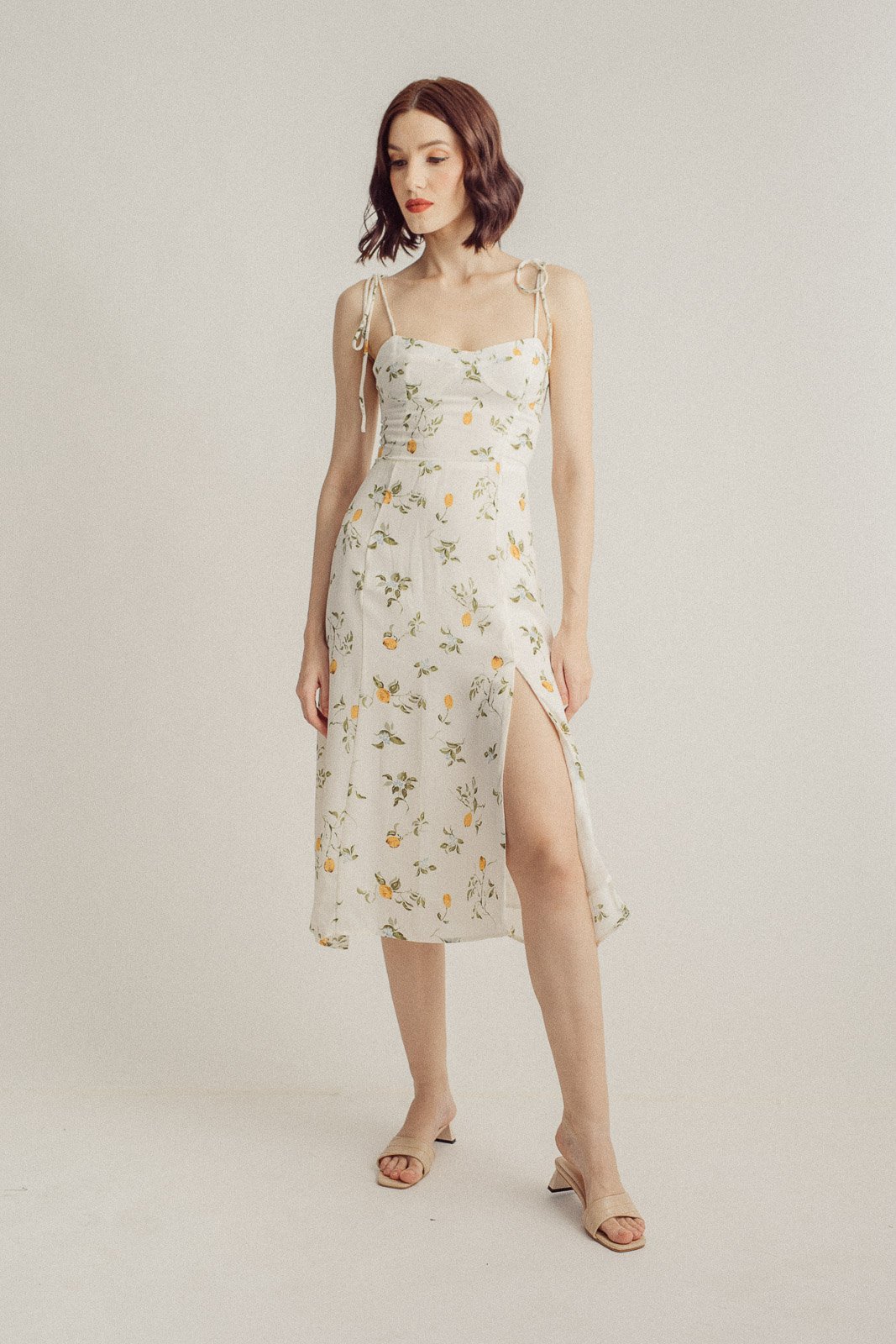Yurina White with Orange Floral All Over Print Sleeveless Self-Tie Midi Dress with Slit