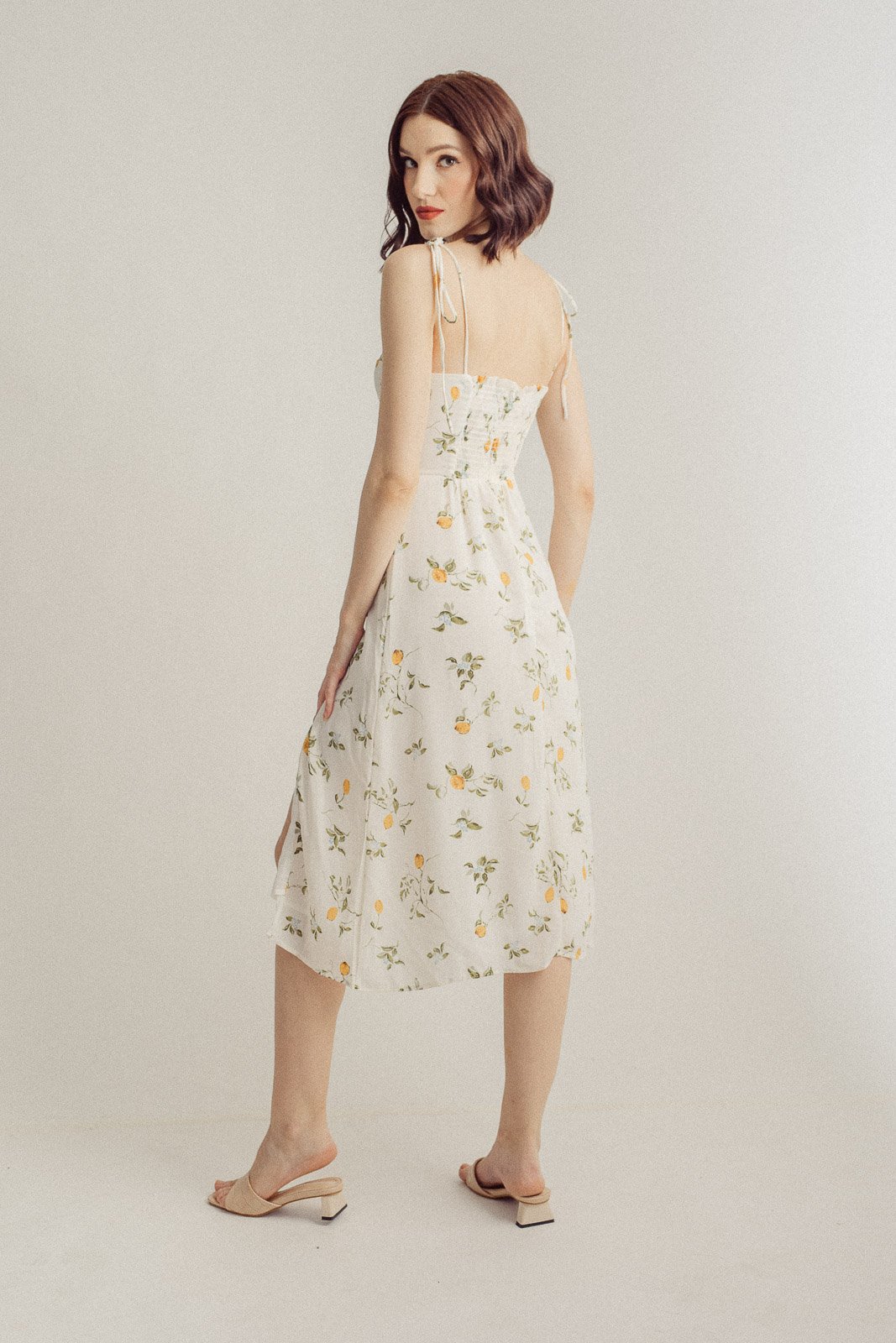 Yurina White with Orange Floral All Over Print Sleeveless Self-Tie Midi Dress with Slit